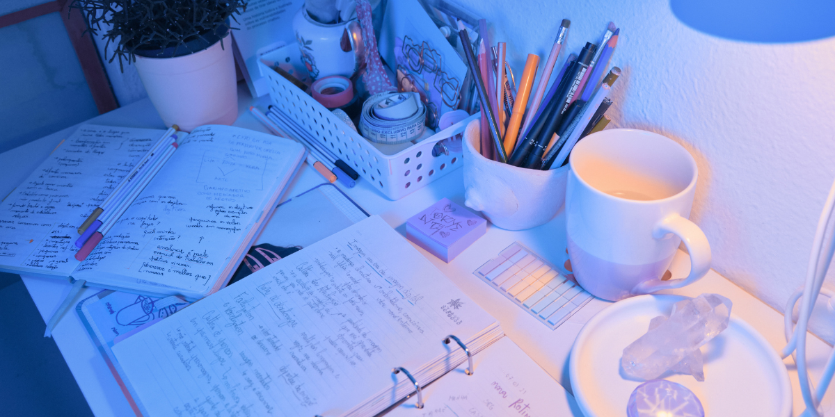 A Year 10 student at a desk with a revision schedule on the wall and a notebook open, building good habits from the start